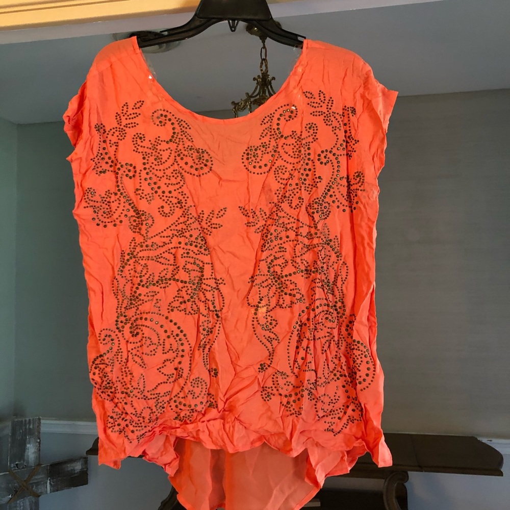 Orange top with beautiful design on front